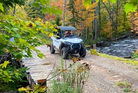 While most prefer to experience the beauty that abounds in Cape Breton this time of year by car, there are those who choose a more adventurous mode of transportation. This enthusiastic sightseer was photographed on a rugged trail just outside of Baddeck. CONTRIBUTED