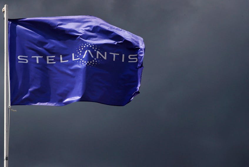A flag with the logo of Stellantis is seen at the company's corporate office building in Saint-Quentin-en-Yvelines near Paris, France, May 5, 2021.