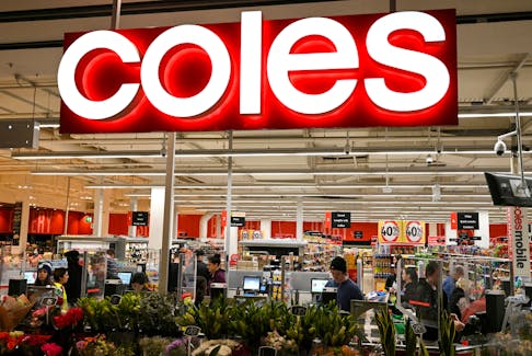 Customers seen in the self-service checkout area of a Coles supermarket in Sydney, Australia, June 17, 2020.