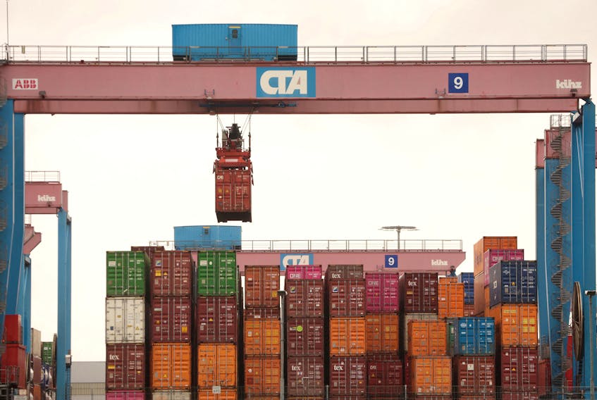 A crane lifts a shipping container at the HHLA Container Terminal Altenwerder on the River Elbe in Hamburg, Germany, March 31, 2023.