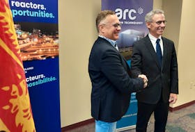 Wayne Long, left, the Saint John-Rothesay Liberal MP, and Bill Labbe, president and CEO of ARC Clean Technology, celebrate $7 million in federal funding for the nuclear firm on Monday. - John Chilibeck, Local Journalism Initiative Reporter, The Daily Gleaner