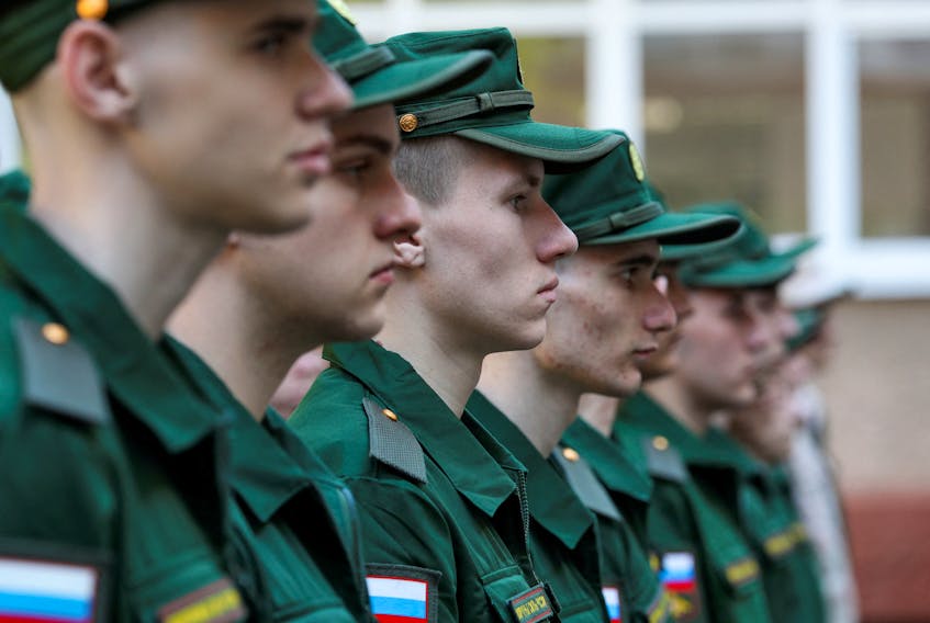 Russian conscripts called up for military service line up before their departure for garrisons as they gather at a recruitment centre in Simferopol, Crimea, April 25, 2023.