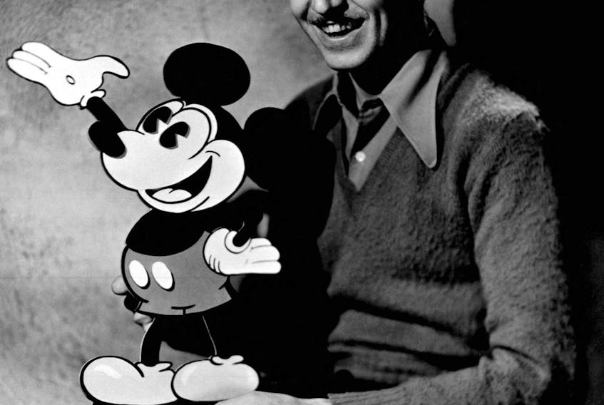 Walt Disney, the pioneering animator, theme park creator and studio founder, is pictured with his famous character Mickey Mouse in this undated file photograph.