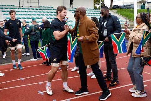 Rugby Union - Rugby World Cup 2023 - South Africa Training - Stade des Fauvettes, Domont, France - October 27, 2023 South Africa's Kwagga Smith is greeted by South Africa Minister of Sports, Arts and Culture Zizi Kodwa ahead of the training session