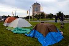 A group of homeless people has set up camp in a field across from the Confederation Building, saying they have nowhere else to go. Keith Gosse • The Telegram