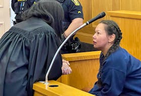 Lorraine Obed (right) speaks with defence lawyer Sara Evans in Newfoundand and Labrador Supreme Court in St. John's Tuesday, Oct. 3.