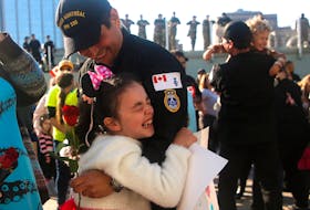A youngster embraces her father (UNIDENTIFIED) at the homecoing ceremony for HMCS Monreal from it's 6 month deployment in the Indo-Pacific...at HMCS Dcckyard in Halifax Tuesday October 3, 2023. Amongst it's duties, took part in Operation Savanne, where they supported Global Affairs with assessing issues with the devoving situarion in Sudan.

TIM KROCHAK PHOTO