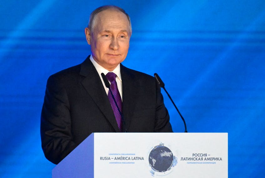 MOSCOW (Reuters) - Russian President Vladimir Putin may hint he will take part in the 2024 presidential election next month, Kommersant newspaper reported on Tuesday, paving the way for the Kremlin