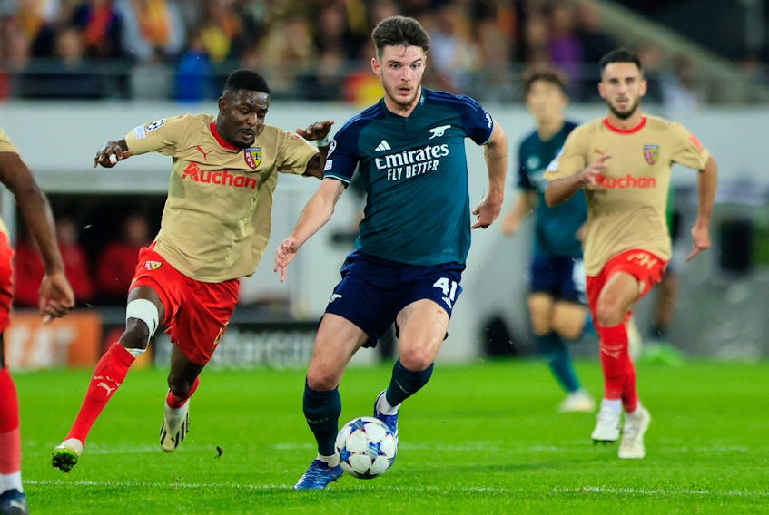 By Julien Pretot and Nicolas Delame LENS, France (Reuters) - RC Lens forward Elye Wahi scored one goal and set up another as his side beat Arsenal 2-1 to top Champions League Group B as they