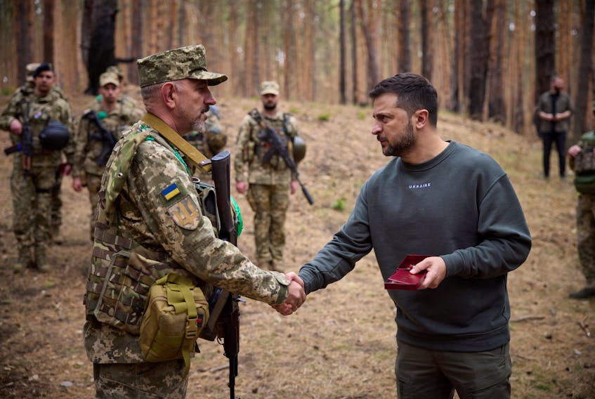 KYIV (Reuters) - Ukrainian President Volodymyr Zelenskiy visited troops fighting in the northeast on Tuesday and met commanders to discuss the battlefield situation on one of the hottest fronts of the