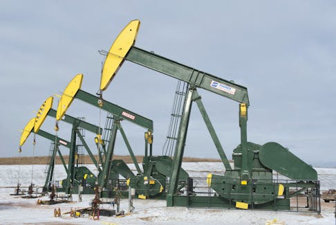 Pumpjacks taken out of production temporarily stand idle at a Hess site while new wells are fracked near Williston, North Dakota November 12, 2014. 