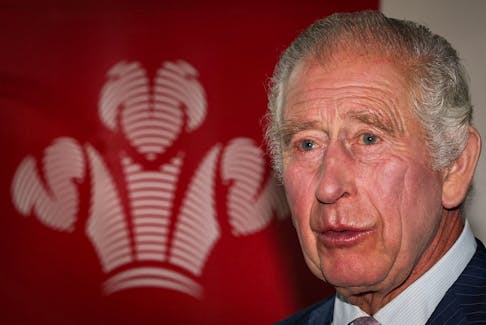 King Charles III stands by the logo of  "The Prince's Trust" as he welcomes guests during a reception for African business leaders, at the Garrison Chapel, Chapel Barracks, in London, Britain on October 18, 2023. ADRIAN DENNIS/Pool via
