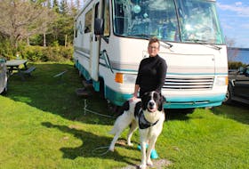 Connie-Lee Martell and her dog, Mr. Jones, outside their motorhome at River Ryan Campground. Illness and the breakdown of her marriage left Martell couch surfing until, with help from a friend, she bought the almost 30-year-old motor home. NICOLE SULLIVAN/CAPE BRETON POST
