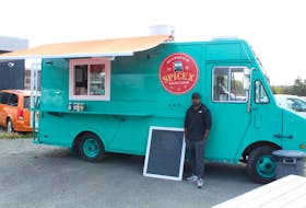Mithun Mathew, owner of SpiceX, stands proudly next to his newly relaunched food truck in Mount Pearl, located at 1161 Topsail Road. Cameron Kilfoy/The Telegram.