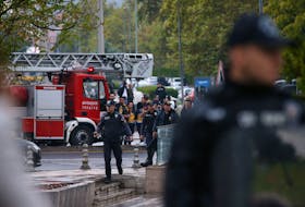 ANKARA (Reuters) - The two attackers who detonated a bomb in front of Turkish government buildings in Ankara at the weekend entered Turkey through Syria, Foreign Minister Hakan Fidan said on Wednesday