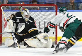 Nicolas Ruccia of the Cape Breton Eagles, left, makes a save while Braeden MacPhee of the Halifax Mooseheads looks for the rebound during Quebec Major Junior Hockey League action at Centre 200 in Sydney on Wednesday. Halifax won the game 2-0. PHOTO/MIKE SULLIVAN, CAPE BRETON EAGLES.