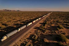 By Jose Luis Gonzalez and Brendan O'Boyle MEXICO CITY (Reuters) - Trucks attempting to enter the United States from Mexico queued for miles on Wednesday amid delays related to record migration at the