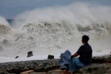 TAITUNG, Taiwan (Reuters) - Typhoon Koinu began brushing past the rural far southern tip of Taiwan on Thursday, bringing lashing rains and strong winds as a swathe of cities across the island