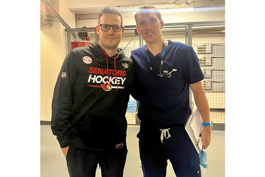 Ian Cox, left, met some former teammates, including Dr. Justin Blaauwendraat, Oct. 4 in Truro. Cox, who was the junior A Bearcats’ equipment manager for six seasons, has been an assistant equipment manager with the Ottawa Senators for nine years.