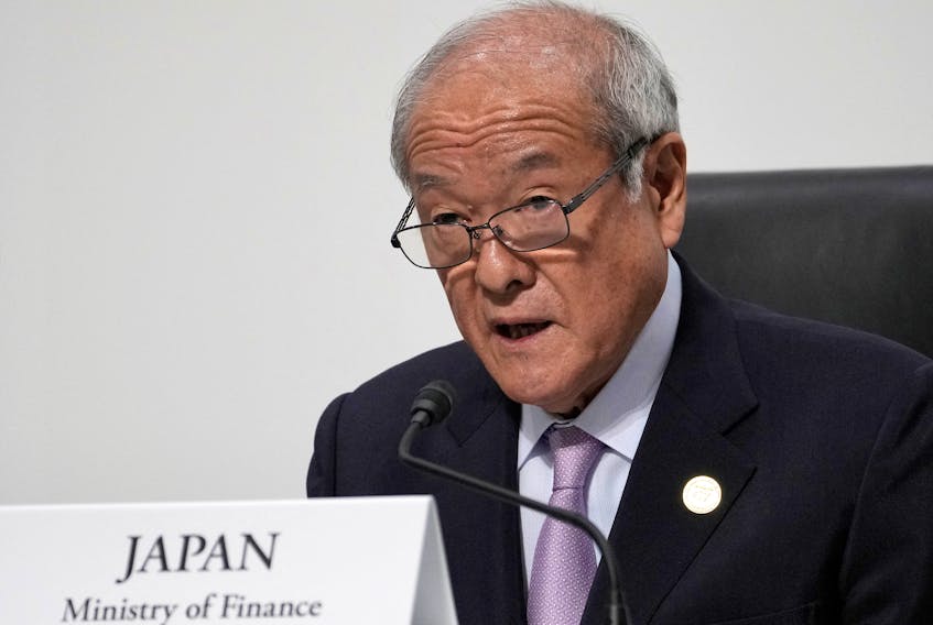 TOKYO (Reuters) - Japanese Finance Minister Shunichi Suzuki said on Friday there were many factors to consider in determining whether moves in the foreign exchange market were "excessive", adding that