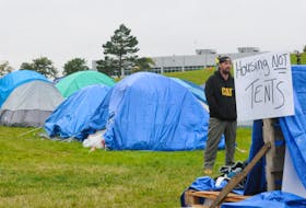 The homeless protest continues this Thanksgiving weekend with the makeshift “tent city” set-up on Prince Philip Drive on the green space near the College of North Atlantic. And on Friday, October 6, 2023, some protestors have set-up camp on the Confederation Building east lawn across the street from their tent friends. Above, a lone protestor is shown by some of the tents as he takes in the events going on.
-Photo by Joe Gibbons/The Telegram
