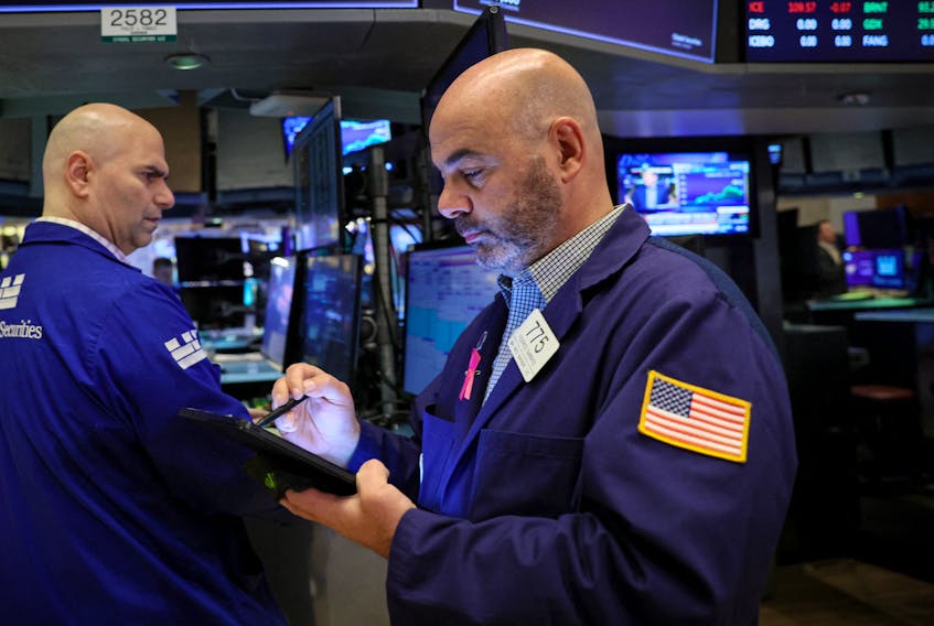 Traders work on the floor of the New York Stock Exchange (NYSE) in New York City, U.S., October 20, 2023. 