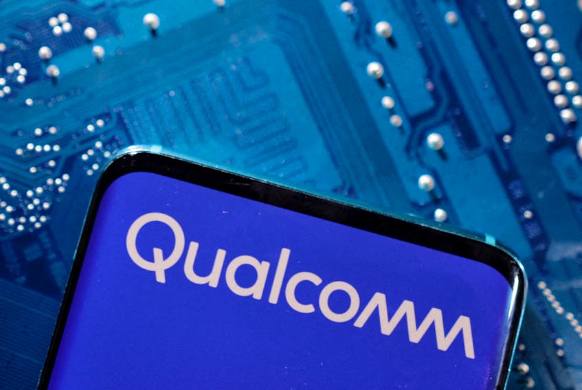 A smartphone with a displayed Qualcomm logo is placed on a computer motherboard in this illustration taken March 6, 2023.