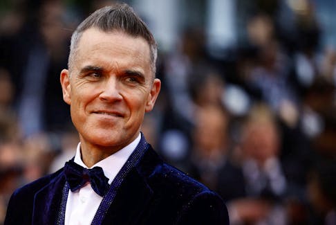 Robbie Williams poses at the Cannes Film Festival in Cannes, France, May 20,  2023.