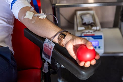 Gabriel Delabays gives blood after Switzerland lifted long-standing restrictions on gay men giving blood, at the transfusion center CRS in Epalinges near Lausanne, Switzerland, November 1, 2023.