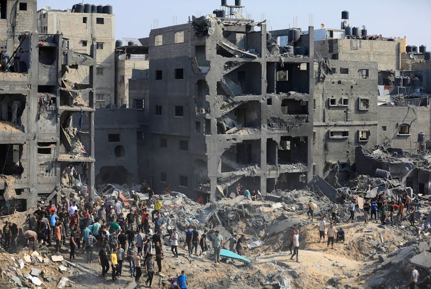 Palestinians search for casualties a day after Israeli strikes on houses in Jabalia refugee camp in the northern Gaza Strip, November 1, 2023.