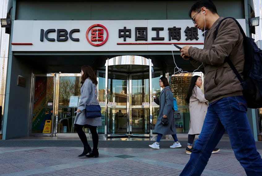 People walk past a branch of Industrial and Commercial Bank of China (ICBC) in Beijing, China April 1, 2019. Picture taken April 1, 2019. 