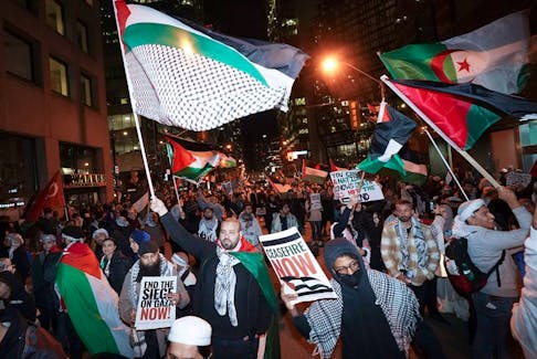 People attend a march for Gaza rally in support of Palestine in Toronto on Nov. 4.
