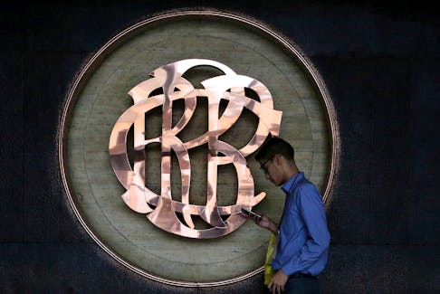 A worker walks pasts the logo of the Central Reserve Bank of Peru (BCRP) inside its headquarters building in Lima, Peru June 16, 2017.