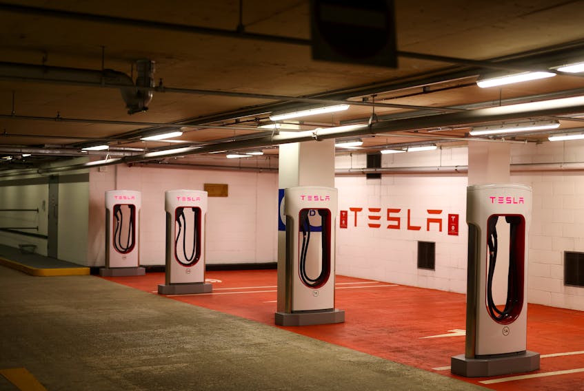 A Tesla electric charging point stands unused in a car park, as Britain will ban the sale of new petrol and diesel cars and vans from 2030, five years earlier than previously planned, in London, Britain, November 18, 2020.