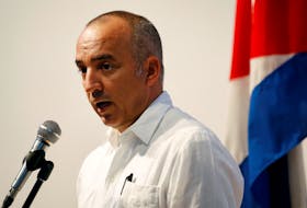 Ernesto Soberon, Foreign Ministry Director of Consular Affairs and Cubans Residing Overseas, delivers a message to the media in Havana, Cuba August 3, 2018.