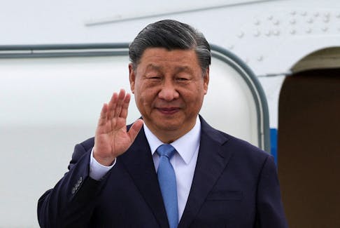 Chinese President Xi Jinping waves as he arrives at San Francisco International Airport to attend the APEC (Asia-Pacific Economic Cooperation) Summit in San Francisco, California, U.S., November 14, 2023.
