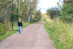 Pedestrians and runners take advantage of the clear weather to enjoy the Confederation Trail on a fall day in P.E.I. Guardian file