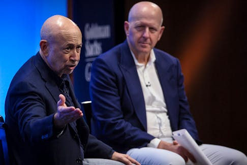 Former Goldman Sachs CEO Lloyd Blankfein and Goldman Sachs chairman and CEO David Solomon speak together during Goldman Sachs analyst impact fund competition at Goldman Sachs Headquarters in New York City, U.S., November 14, 2023.