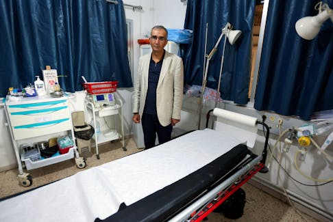 Mounes Klakesh, director of Marjayoun hospital, stands as he attends an interview with Reuters at the hospital in Marjayoun, southern Lebanon November 13, 2023.