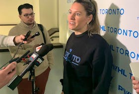 Toronto PWHL player Natalie Spooner speaks with media members.