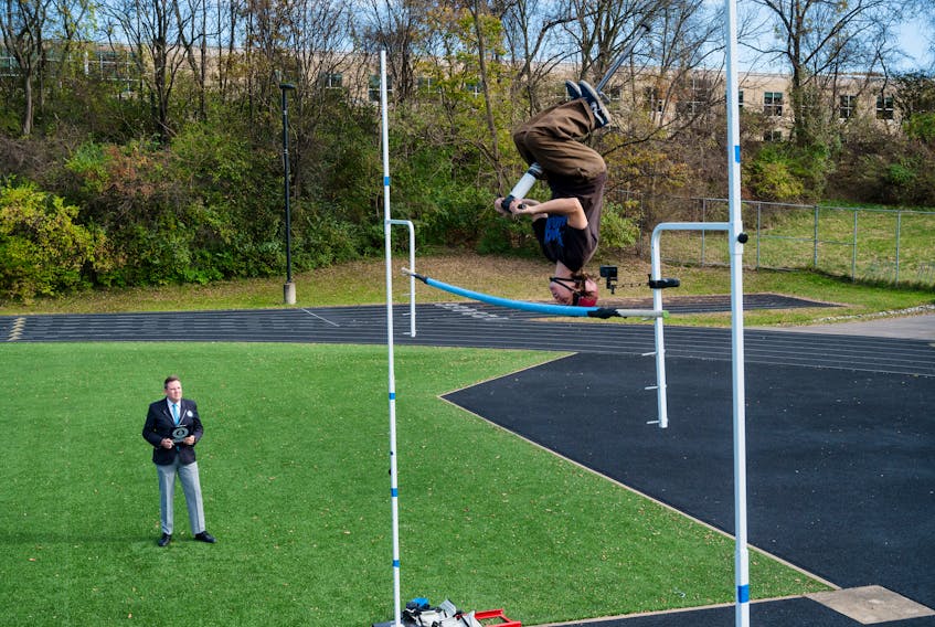 Henry Cabelus, from U.S., achieves the highest backflip pogo stick jump is 3.07 m (10 ft 1 in), in Pittsburgh, Pennsylvania, U.S. November 4, 2023 in this handout picture released in celebration of Guinness World Records Day 2023.  Guinness World Records Day 2023/Handout via REUTERS