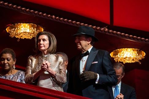 House Speaker Nancy Pelosi and her husband Paul Pelosi, who is wearing a hat and glove following an attack by accused David Wayne DePape in his home in November, attend the Kennedy Center honorees gala in Washington, D.C., U.S., December 4, 2022.