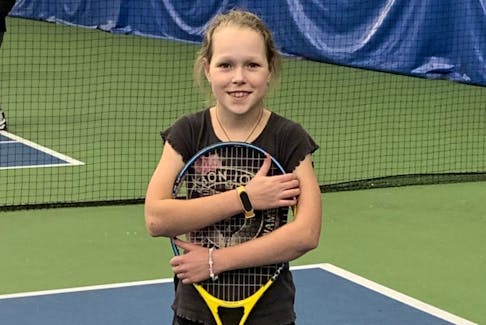 10 year old Stephania Lavreka of Truro Elementary School is enjoying tennis lessons at the Cougar Dome while making new friends.