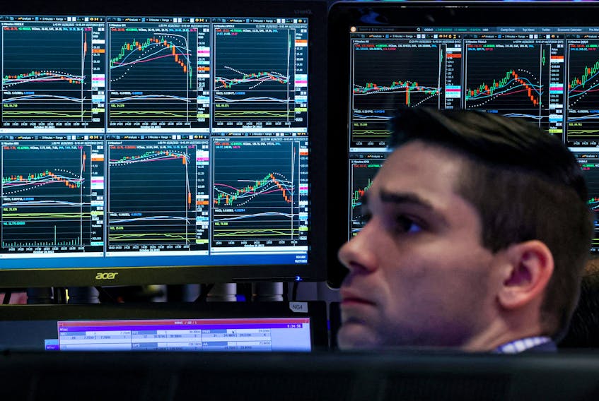 A trader works on the floor at the New York Stock Exchange (NYSE) in New York City, U.S., October 27, 2023. 