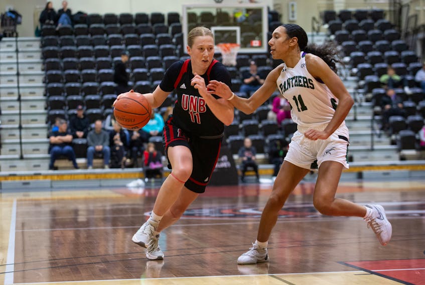 UNB’s Erin Ingalls, left, drives into the lane against the UPEI Panthers’ Lauren Rainford during an Atlantic University Sport (AUS) women’s basketball game in Fredericton on Nov. 11. UNB won the game 65-54. UPEI hosts Saint Mary’s on Nov. 17 at 6 p.m. James West Photo/UNB Athletics • Special to The Guardian