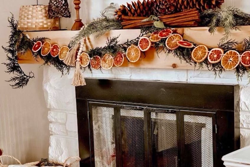 “It’s all about making personal touches that are meaningful to you and your family that can add that extra little bit of magic to the season,” says Katie Parsons Garland, who loves layering her mantle during the holidays. - Katie Parsons Garland