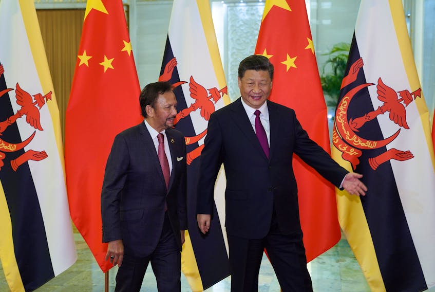 Chinese President Xi Jinping shows the way to the meeting room to Brunei's Sultan Hassanal Bolkiah before the bilateral meeting of the Second Belt and Road Forum at the Great Hall of the People on April 26, 2019 in Beijing, China. Andrea Verdelli/Pool via