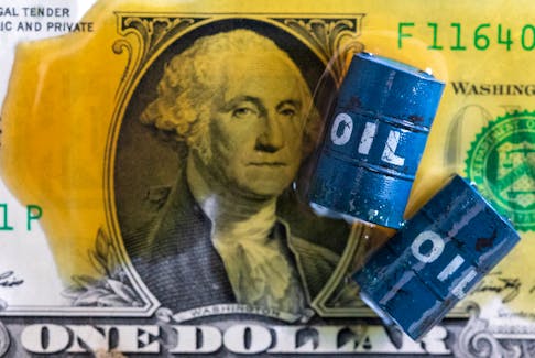Oil, miniatures of oil barrels and U.S. dollar banknote are seen in this illustration taken, June 6, 2023.