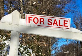 A house-for-sale sign is seen inside the Washington DC Beltway in Annandale, Virginia January 24, 2016.  