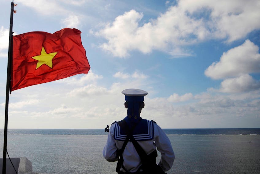 A Vietnamese naval soldier stands quard at Thuyen Chai island in the Spratly archipelago in the South China Sea on January 17, 2013. China, Vietnam, the Philippines, Malaysia, Brunei and Taiwan all claim territory in the sea, which covers important shipping routes and is thought to hold untapped oil and gas reserves. Picture taken on January 17, 2013.